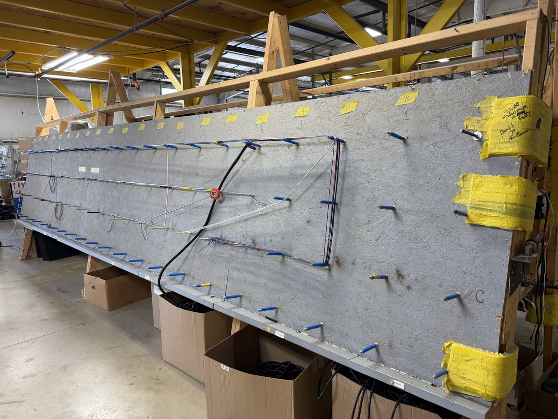 Harness being built on the board in HLE's shop