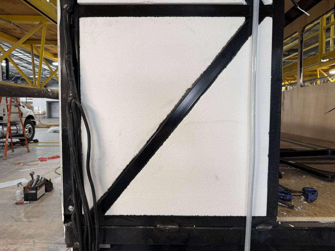 Rear 45-degree structural brace welded into the cage corner