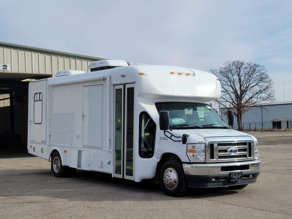 White mobile treatment unit on a Ford E-450 cutaway, front three-quarter, outside