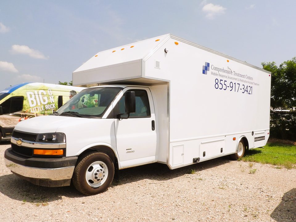 Mobile treatment unit on a Chevrolet 4500 cutaway, front three-quarter