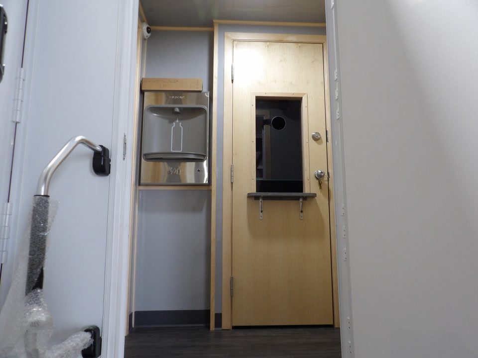 Dispensing window and door inside the treatment unit