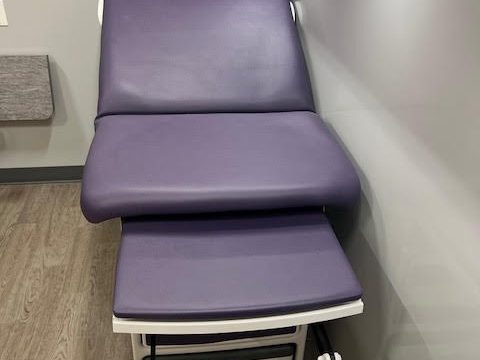 Purple power exam chair inside the clinic