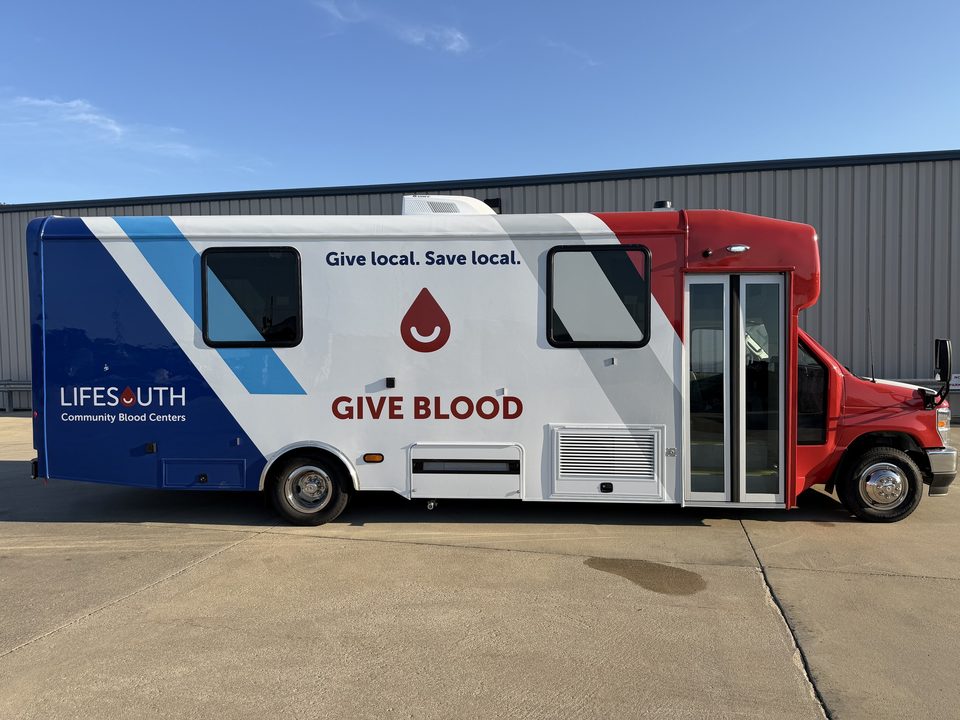 Bloodmobile, passenger side with entry door and awning