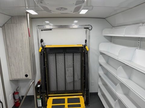 Wheelchair lift at the rear door of the bookmobile