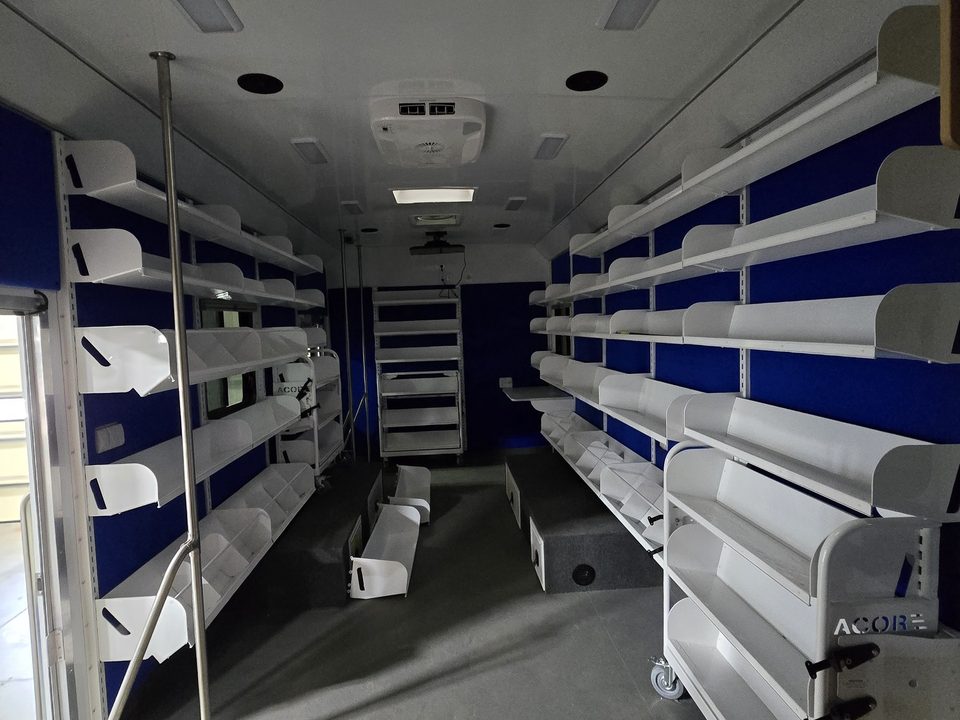 Bookmobile interior: shelving both sides, skylight