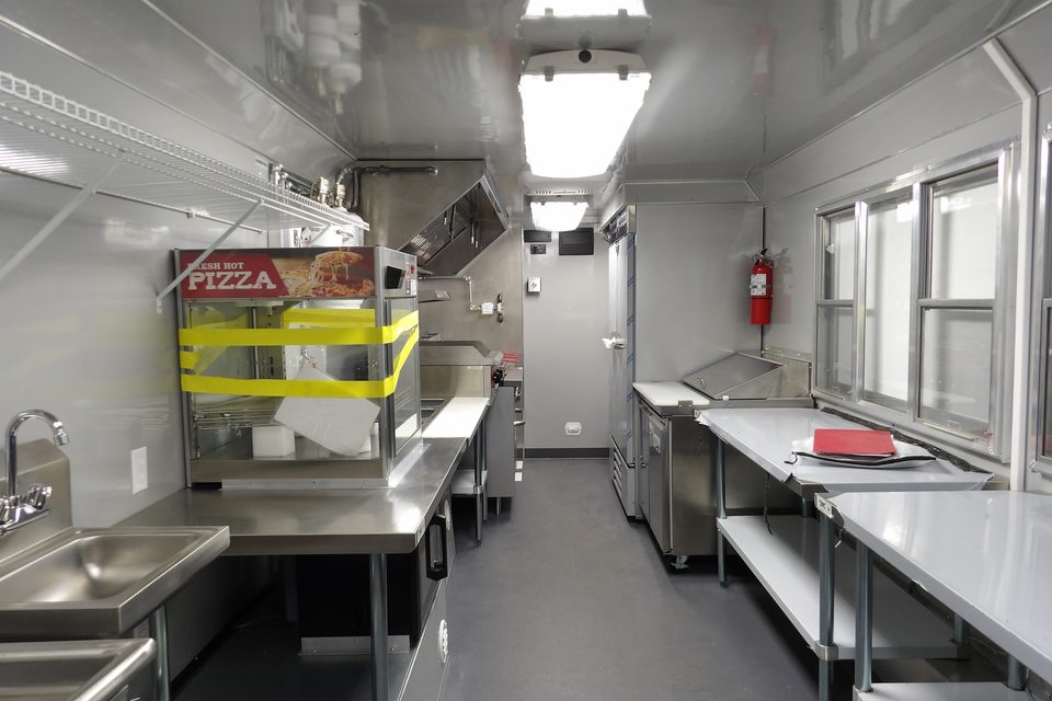 Food trailer kitchen: hood, range, prep tables