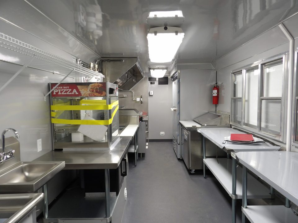 Food trailer kitchen: hood, range, prep tables