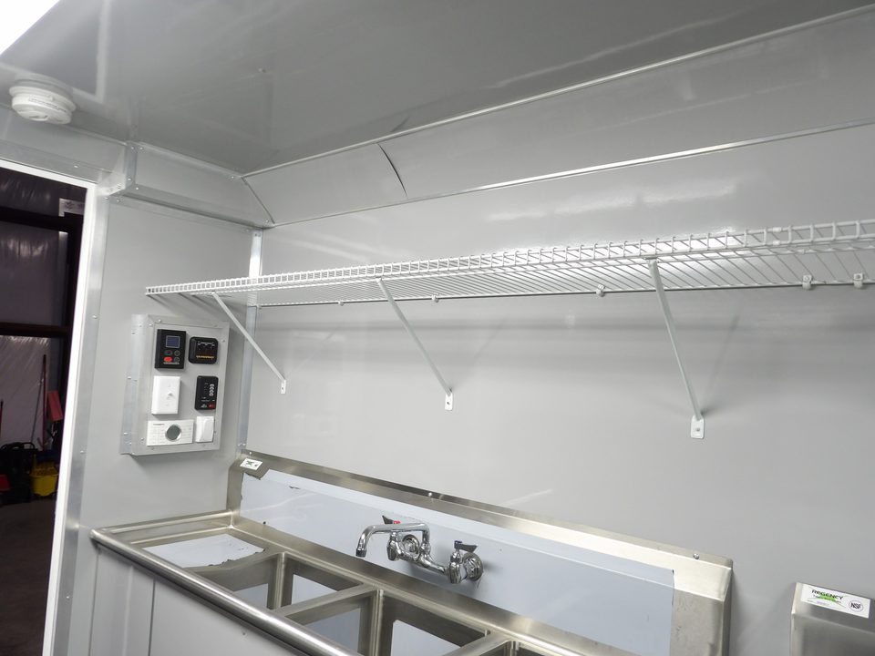 Food trailer prep area with shelving