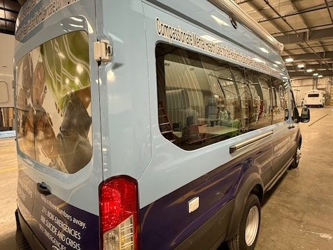 Counseling van, rear three-quarter, in the plant