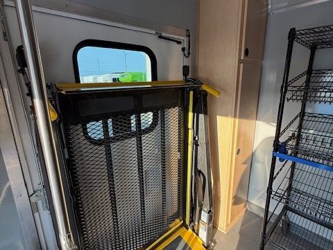Wheelchair lift and wire shelving inside the food pantry