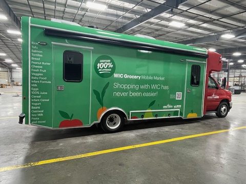 Mobile market, driver side, awning rolled on the roof