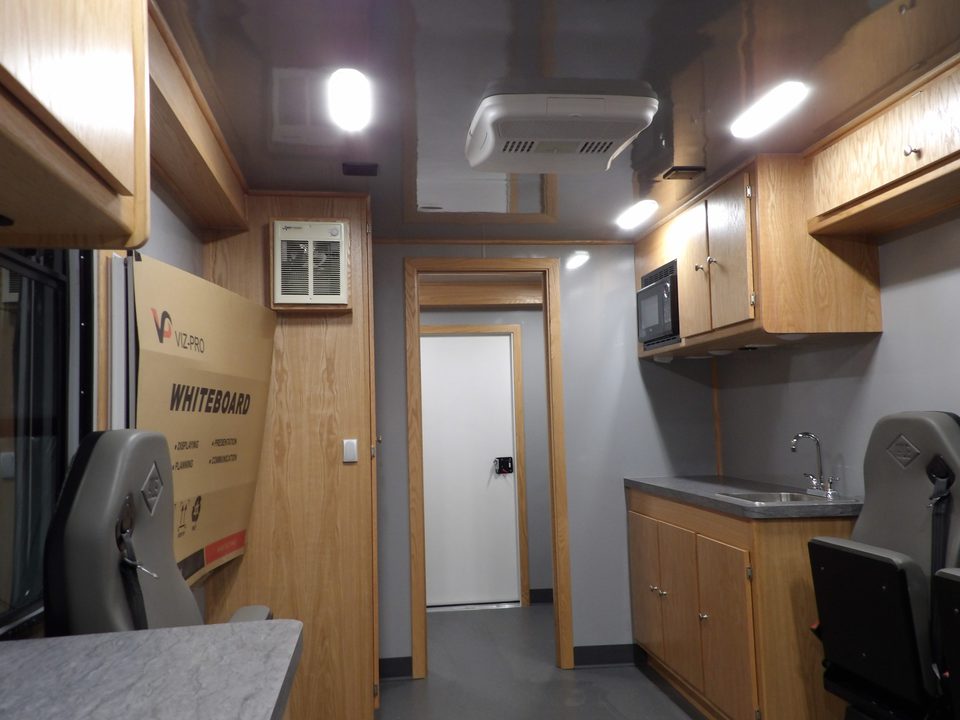 Mobile office interior: counters, cabinets, seating