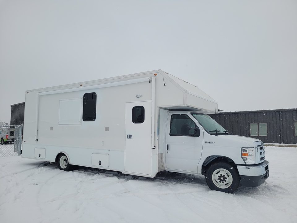 Mobile office unit in snow, front three-quarter