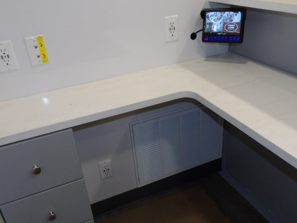 Reception desk with quartz top and drawers inside the mammography unit