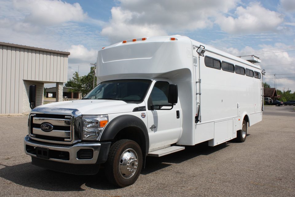 White mobile command unit on a Ford F-550, front three-quarter