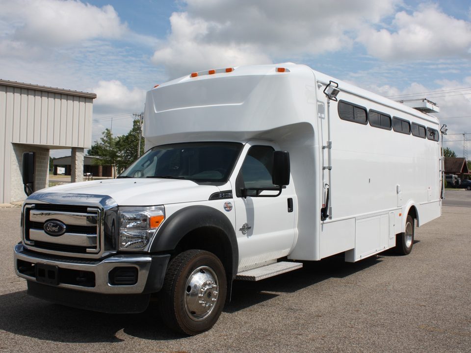 White mobile command unit on a Ford F-550, front three-quarter