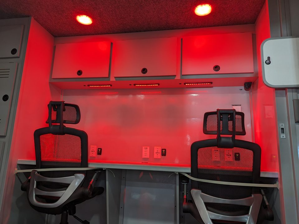 Command unit interior under red night lighting