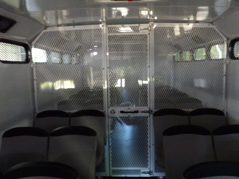 Prisoner transport interior: mesh compartments and molded seats