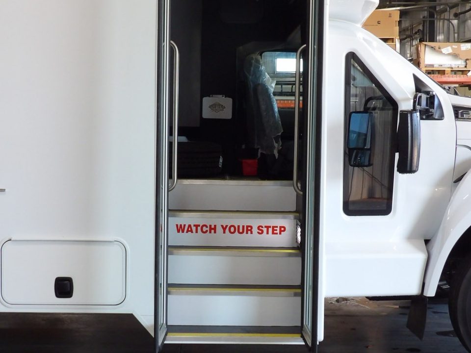 Prisoner transport entry door with steps