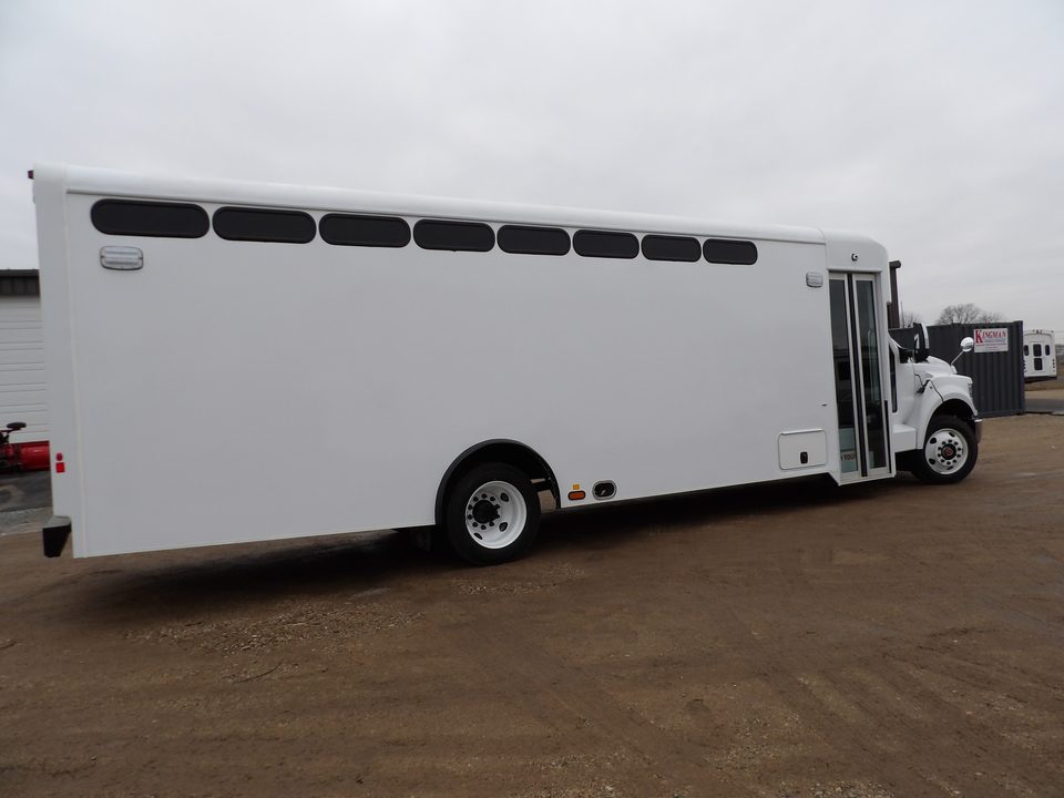 Prisoner transport bus, driver side, slot windows along the body