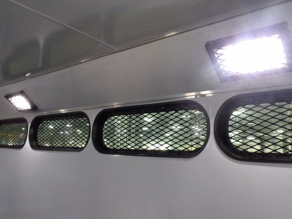 Prisoner transport slot windows with mesh