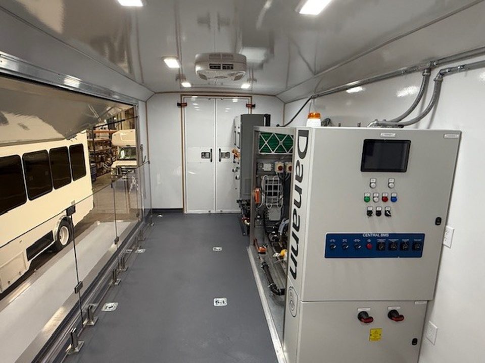 Mechanical training unit interior: cooling-system trainer, fold-out glass wall, gray floor