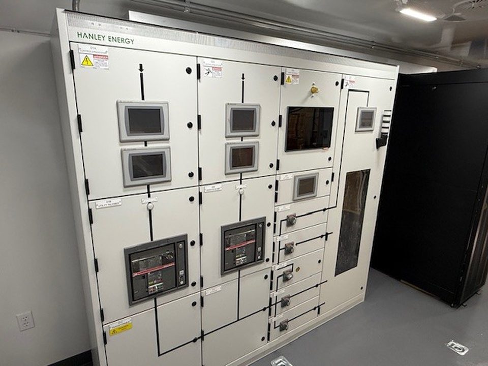 Training unit interior: a full switchgear lineup with control screens