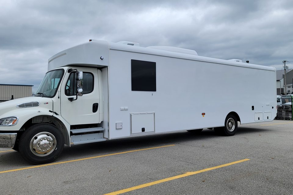 Mobile voting unit on a Freightliner M2, white, side