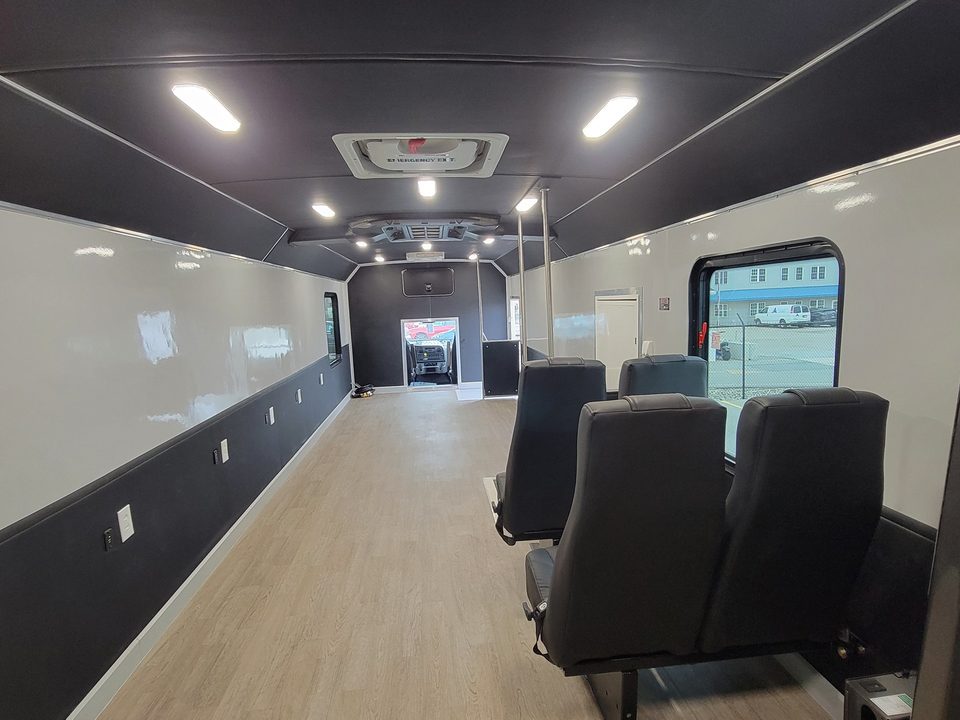 Mobile voting unit seating and wheelchair lift