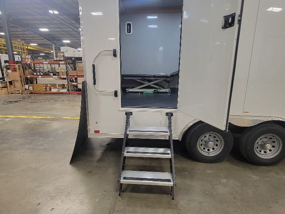 Trailer entry door open with fold-down steps