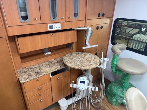 Dental cabinetry with granite counter, delivery unit and stools