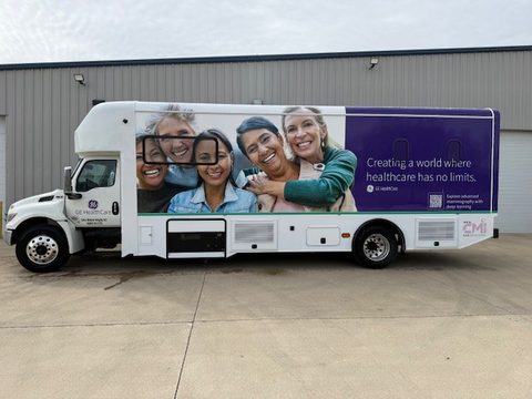 Mammography unit, passenger side, purple wrap with a photo panel