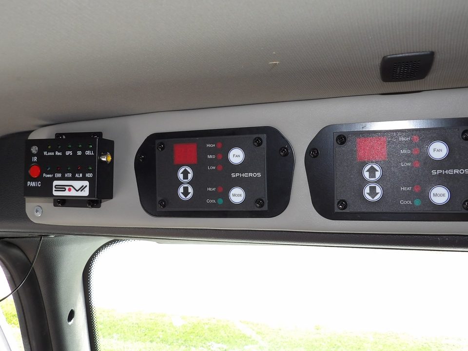 Overhead control console with switch panels above the windshield