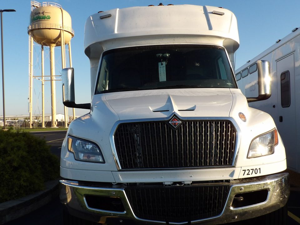Prisoner transport front, International MV grille, Wakarusa water tower behind