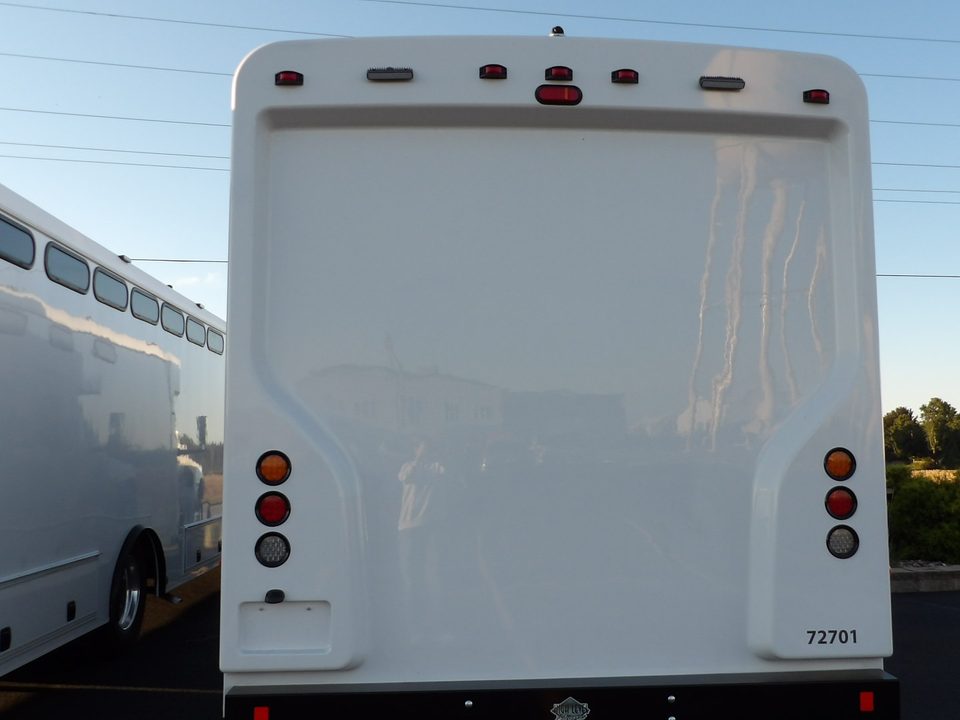 Prisoner transport, rear three-quarter, slot windows along the body