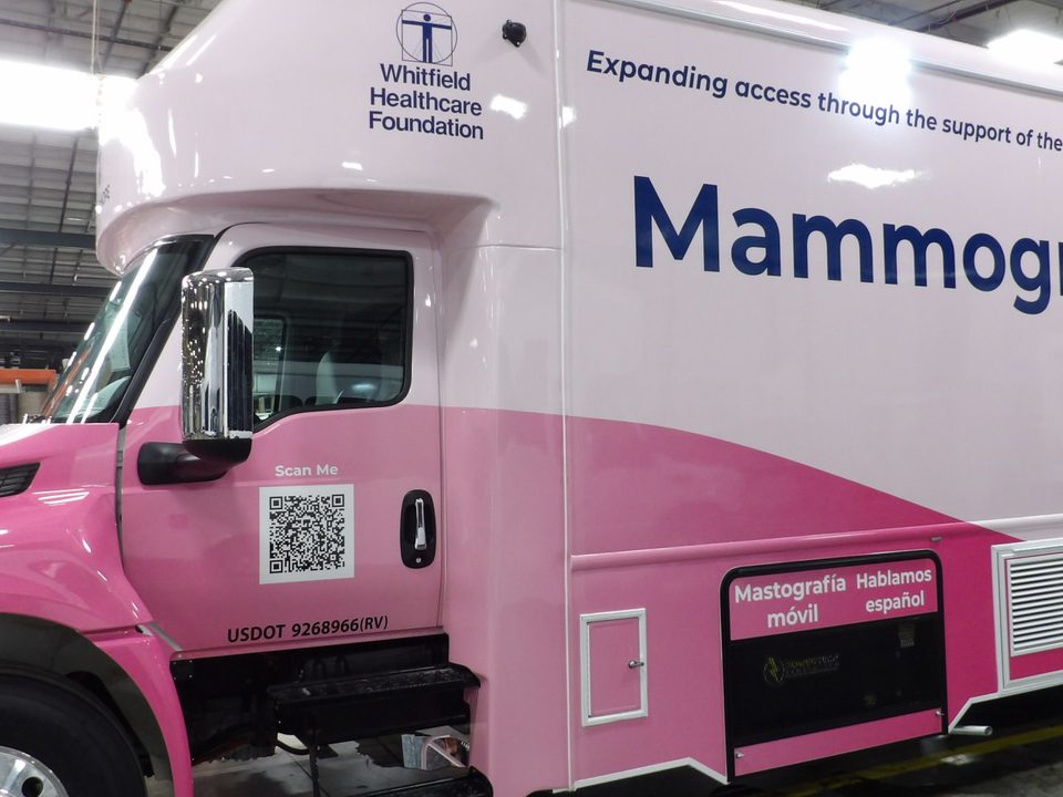 Mammography unit, driver side, pink wrap with Mammography on the go