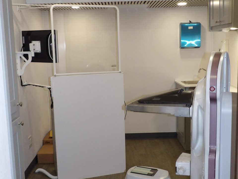 Mammography system in the exam room, looking forward through the unit