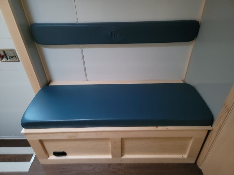 Navy bench seat with storage below