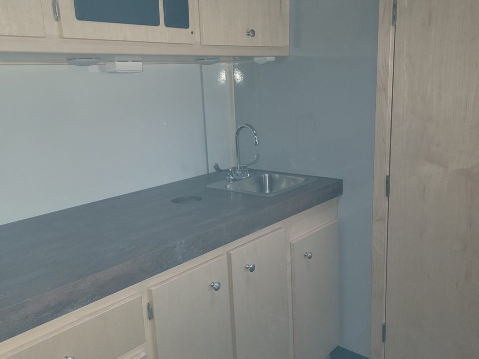 Cabinets and sink counter looking aft