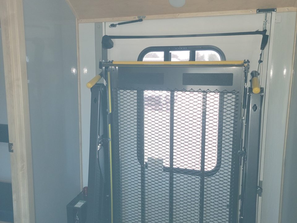 Wheelchair lift stowed inside the health van
