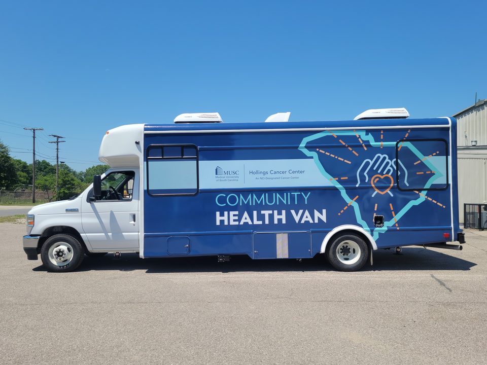 Community Health Van, driver side, navy wrap with the South Carolina outline