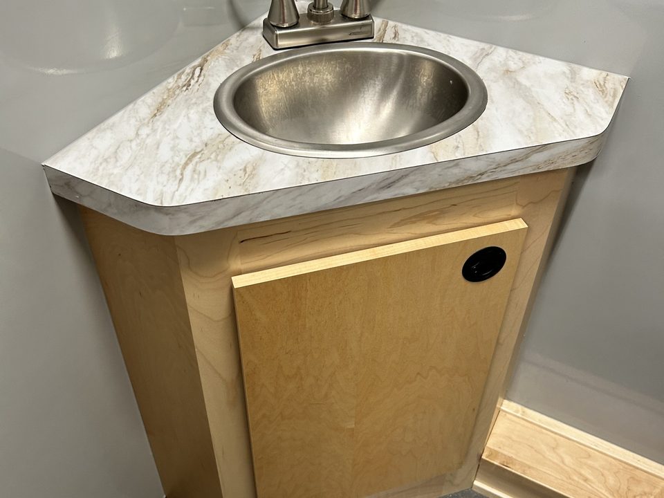 Corner sink cabinet inside the clinic
