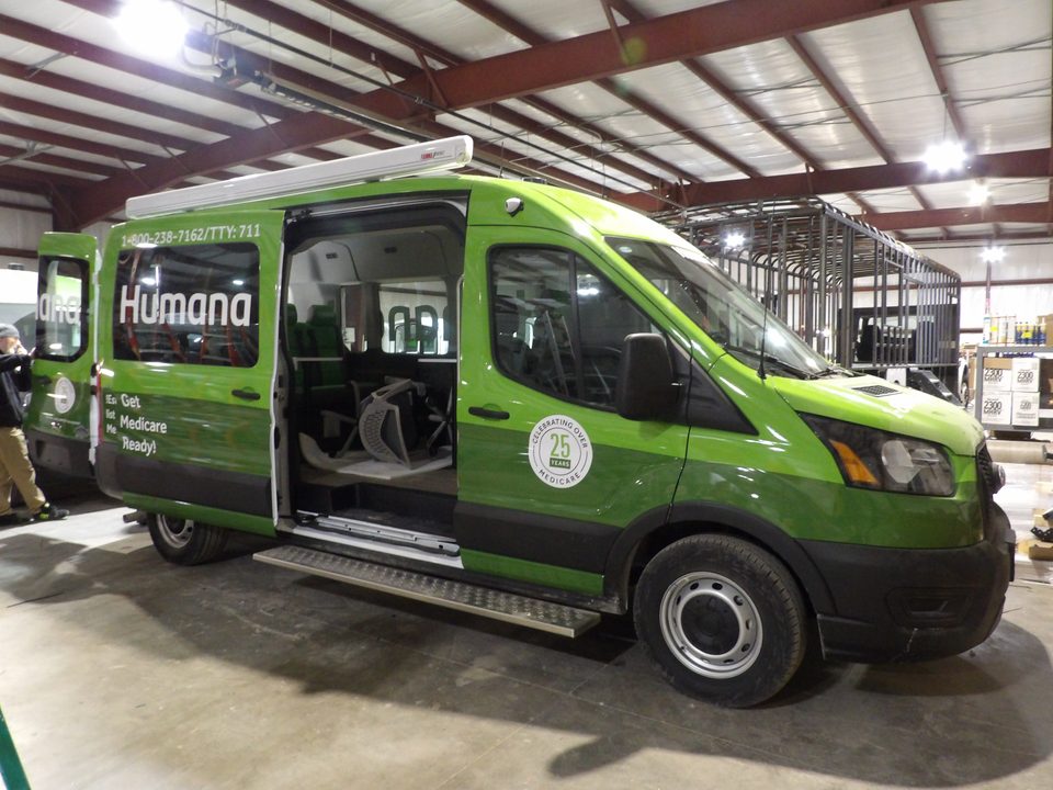 Humana outreach van with side door open and awning mounted