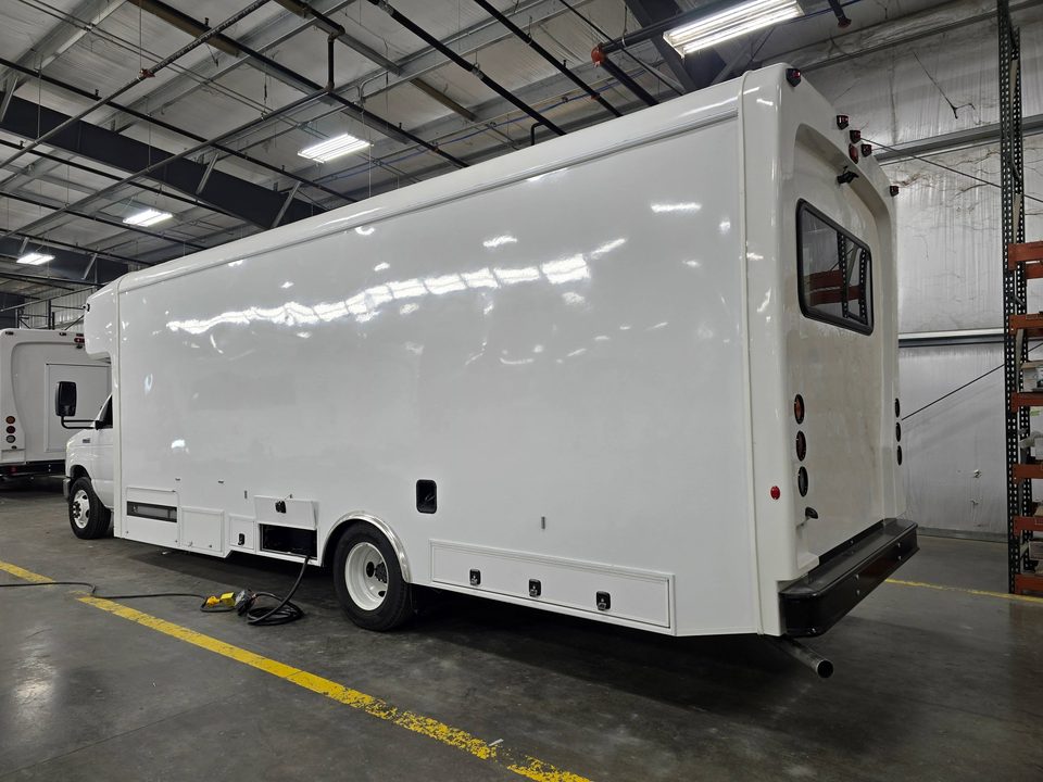 Mobile outreach unit, rear three-quarter, in the plant