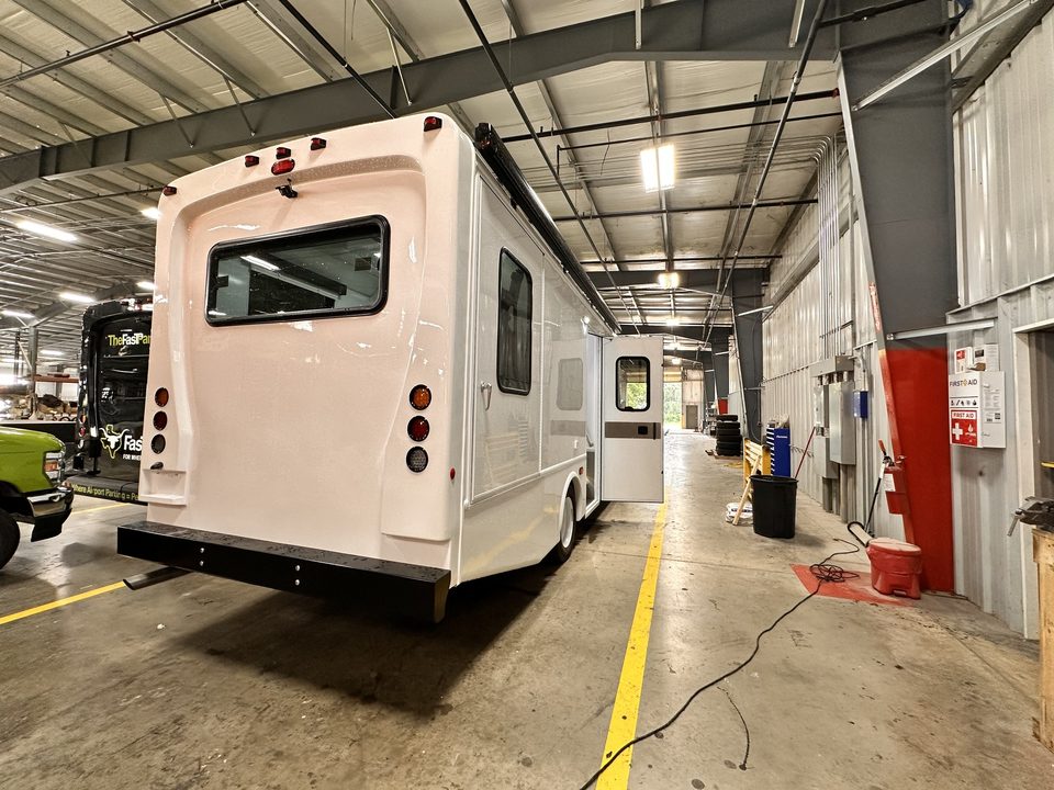 Mobile outreach unit, rear three-quarter, in the plant