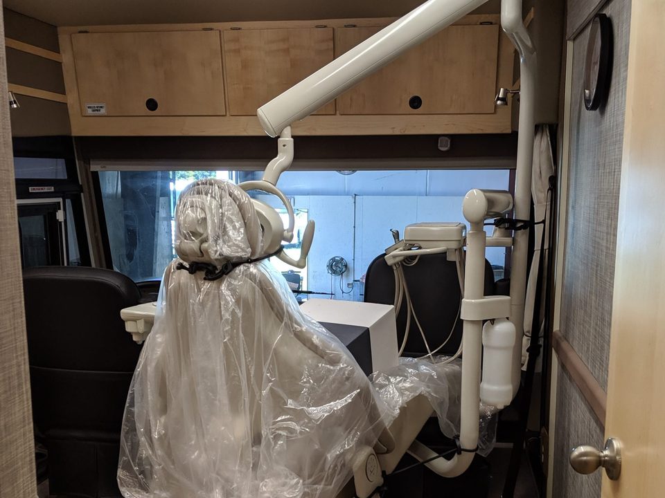 Mammography unit installed inside a mobile imaging coach, in protective wrap