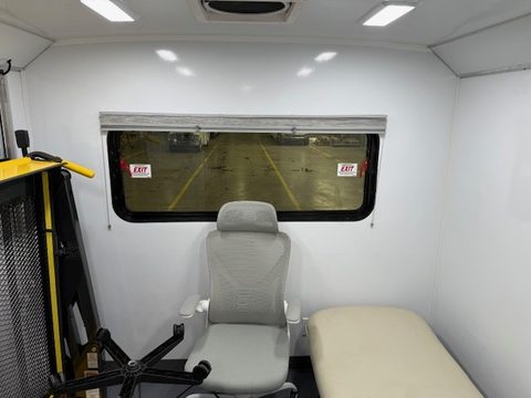 Exam chair and task chair beside the wheelchair lift