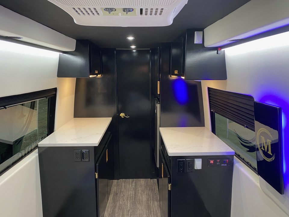 Interior under blue LED accent lighting, counters both sides
