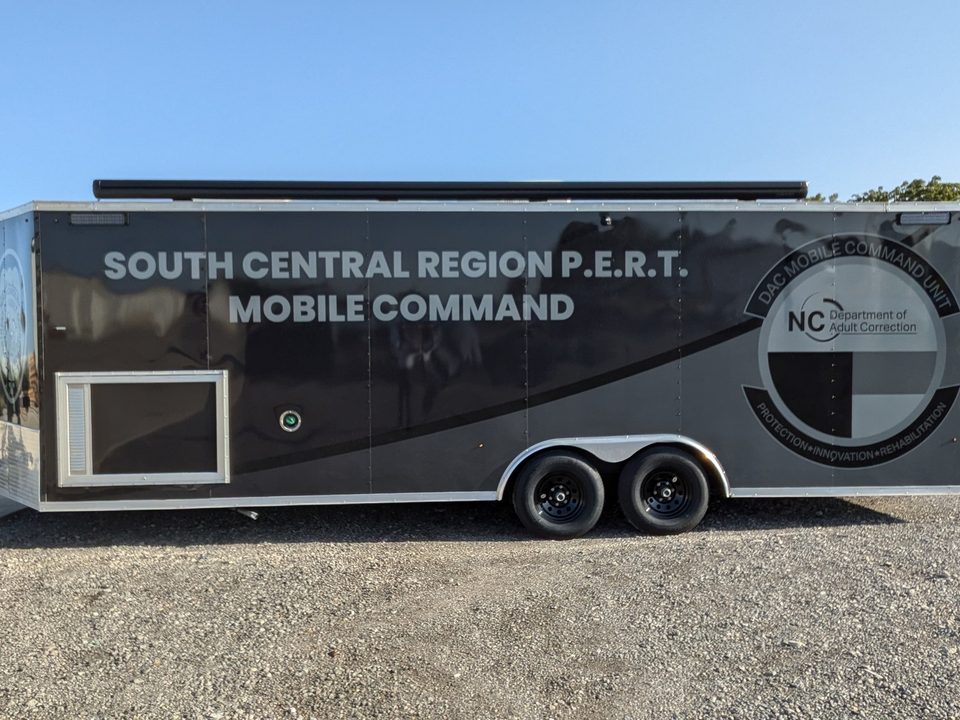 Mobile command trailer outside, front three-quarter