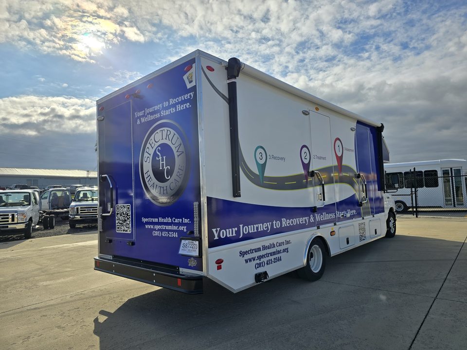 Mobile recovery unit, rear three-quarter, Spectrum Health Care wrap